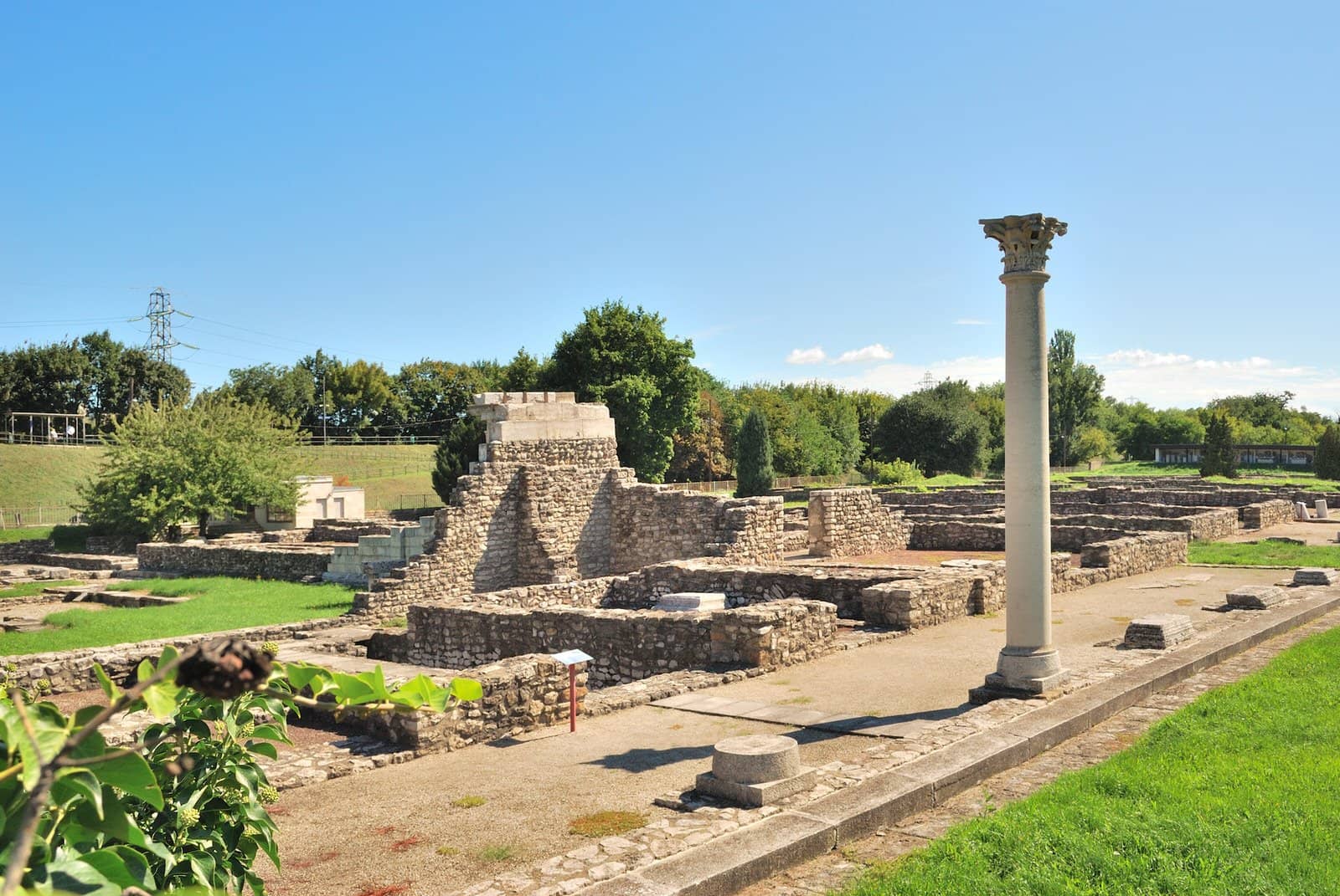 Aquincum Roman baths, Budapest The ruins of the Aquincum Roman baths, a collection of small walls and pillars standing in a green field in Budapest, Hungary