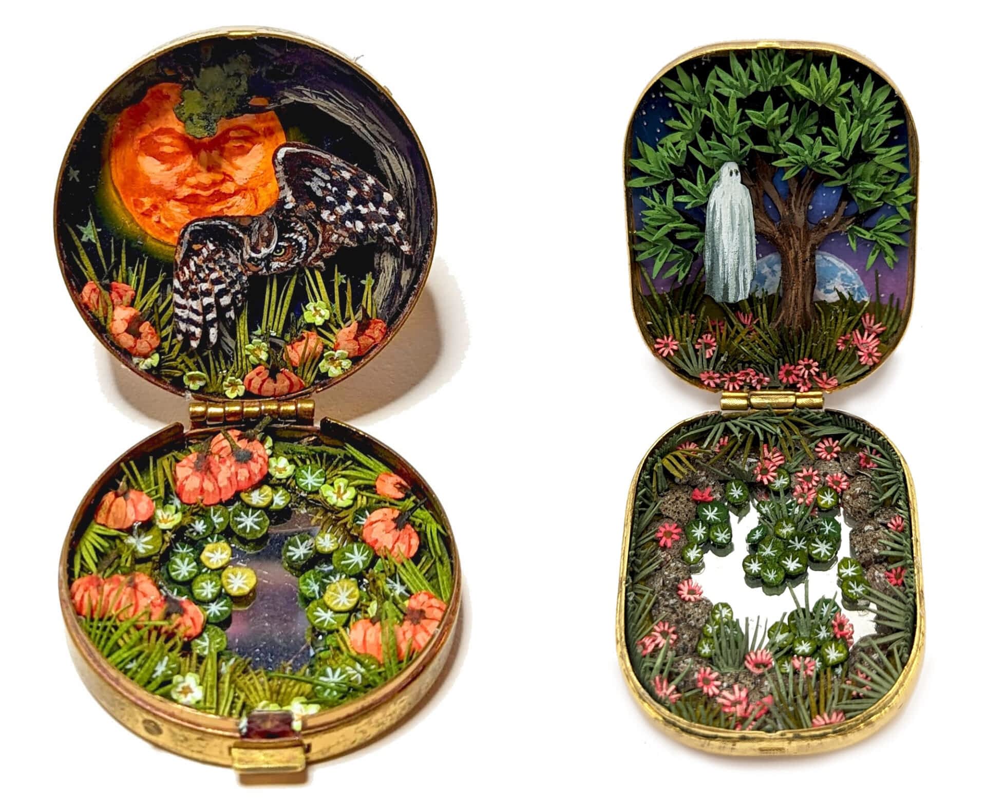 two tiny dioramas made from watercolor-painted paper inside of vintage cosmetics compacts depicting (on the left) a woodland scene with an owl and an orange moon with a face, and (on the right) a ghost standing next to a tree over a mirrored pond with wildflowers