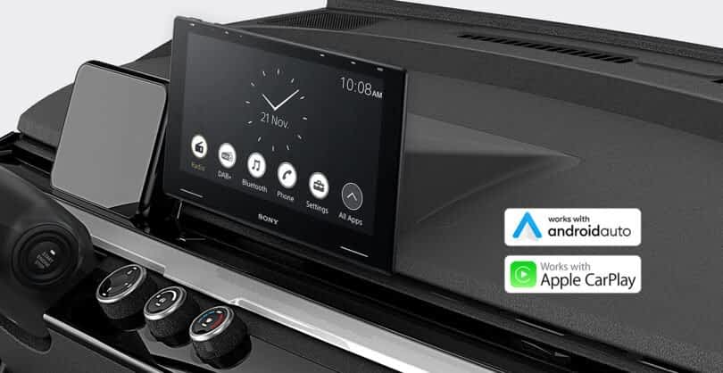 Close-up view of a micro EV dashboard featuring a modern touchscreen infotainment system compatible with Android Auto and Apple CarPlay.