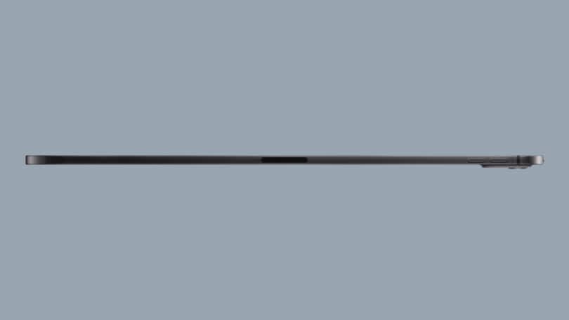 Side view of a thin, black Apple iPad Pro showing buttons on the right side and a camera bump on the upper-right corner.