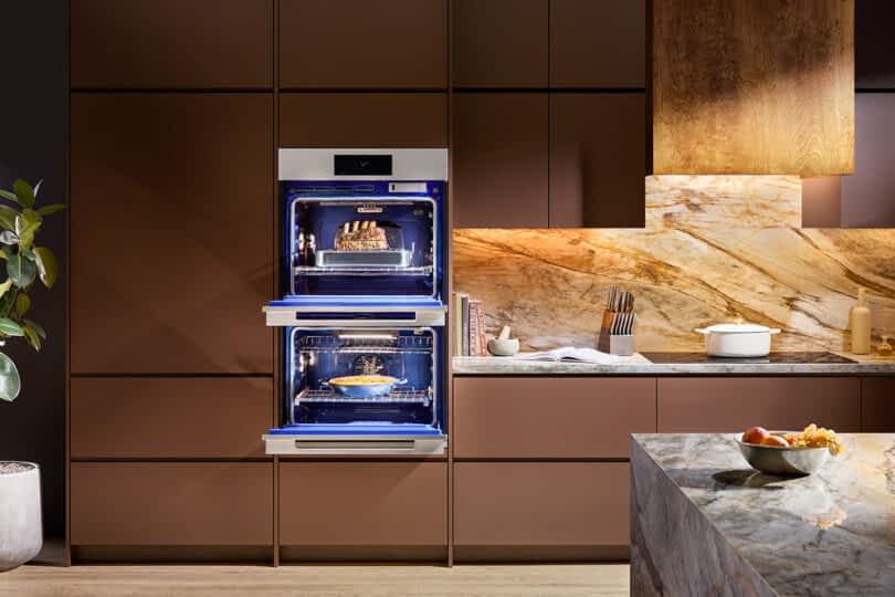 SKS Transitional Double Wall Oven with both oven doors open revealing a roast and casserole cooking within.