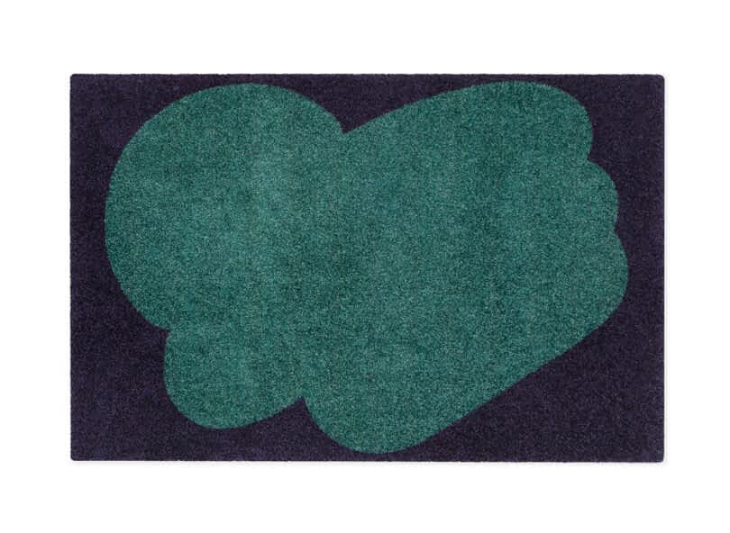 two tone green and black floor mat with abstract pattern