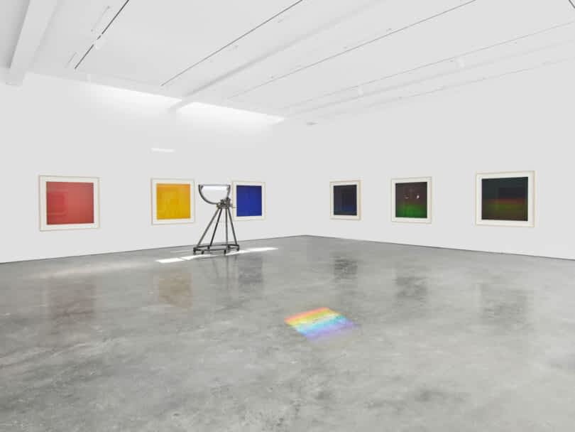Prism projects rainbow on floor of gallery