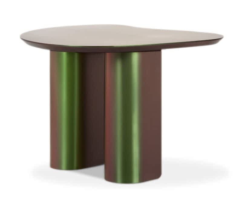 A modern iridescent table with an irregularly shaped top and cylindrical legs.