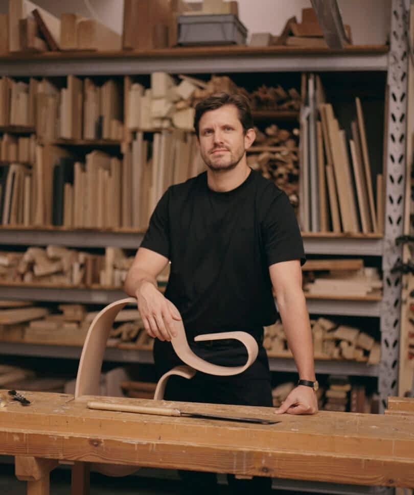 man holding rocking horse prototype