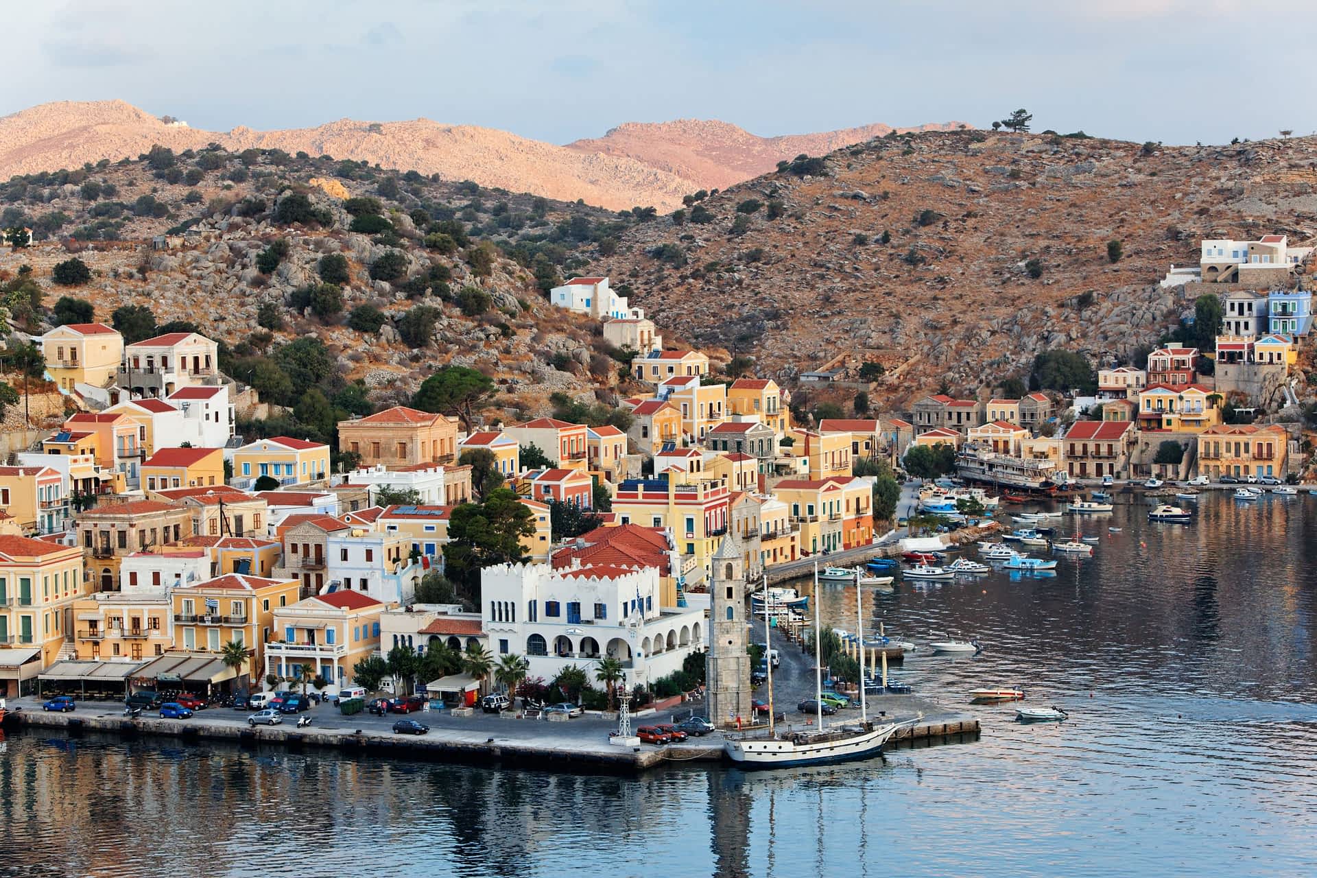 Symi Island, Greece A Greek seaside village with houses built on the rocky hills