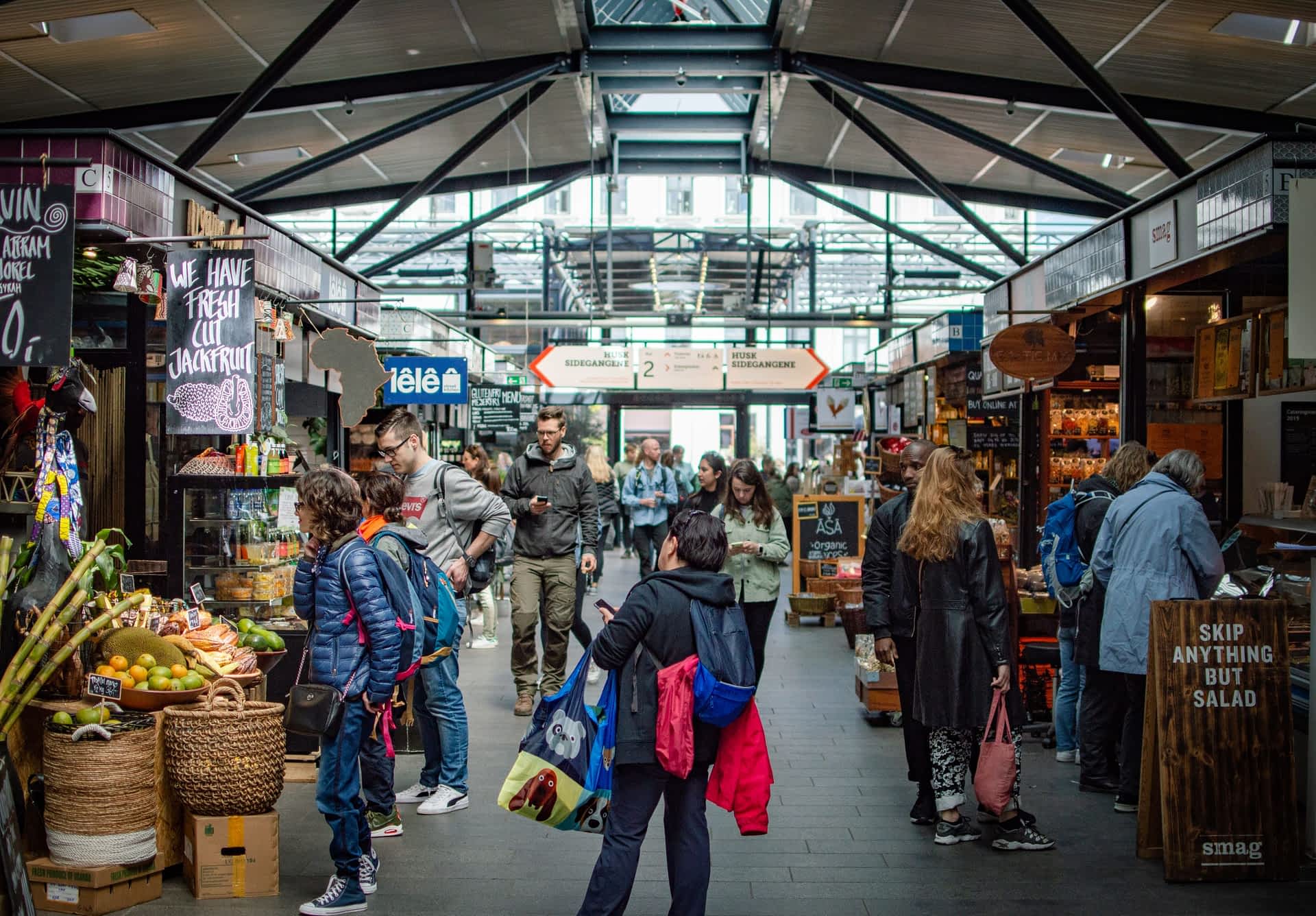 Torvehallerne, Copenhagen People wander through a covered food market in Copenhagen.