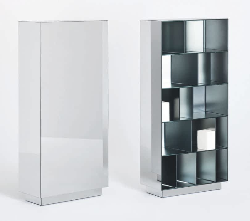 Modern metal storage unit with a geometric design featuring multiple square and rectangular compartments, positioned against a plain white background.