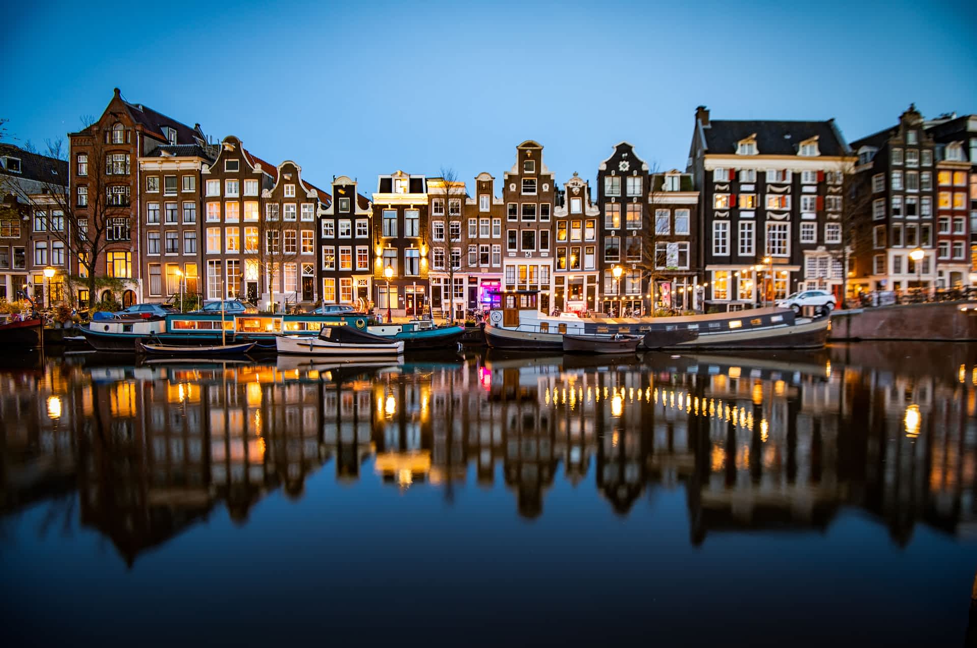 Singel canal, Amsterdam, the Netherlands Historic homes along the Singel canal after dark, Amsterdam, the Netherlands