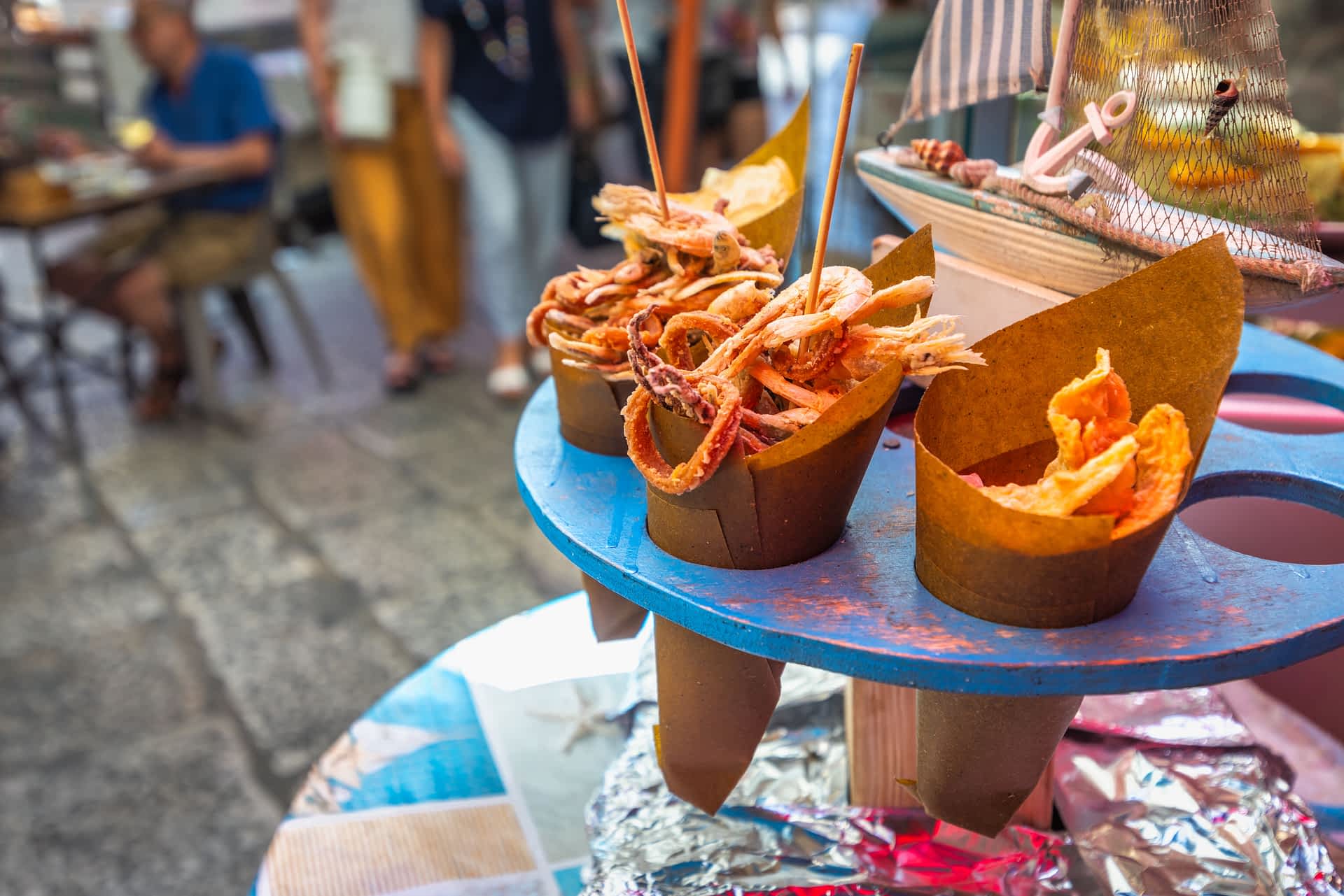 Palermo Street Food Cones filled with fried seafood sit at a food stall in Palermo.