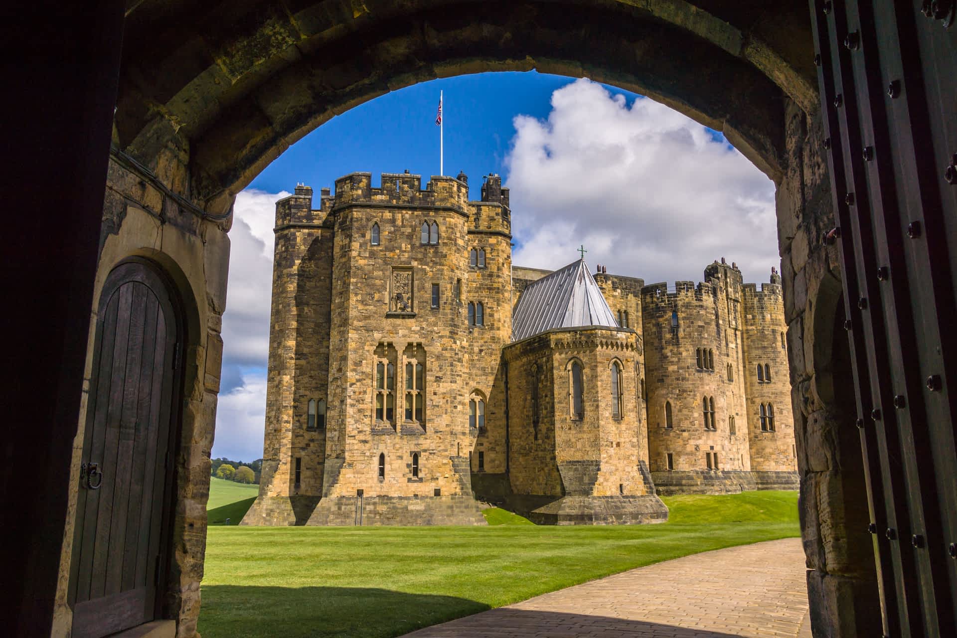Alnwick Castle in Northumberland seen through a window