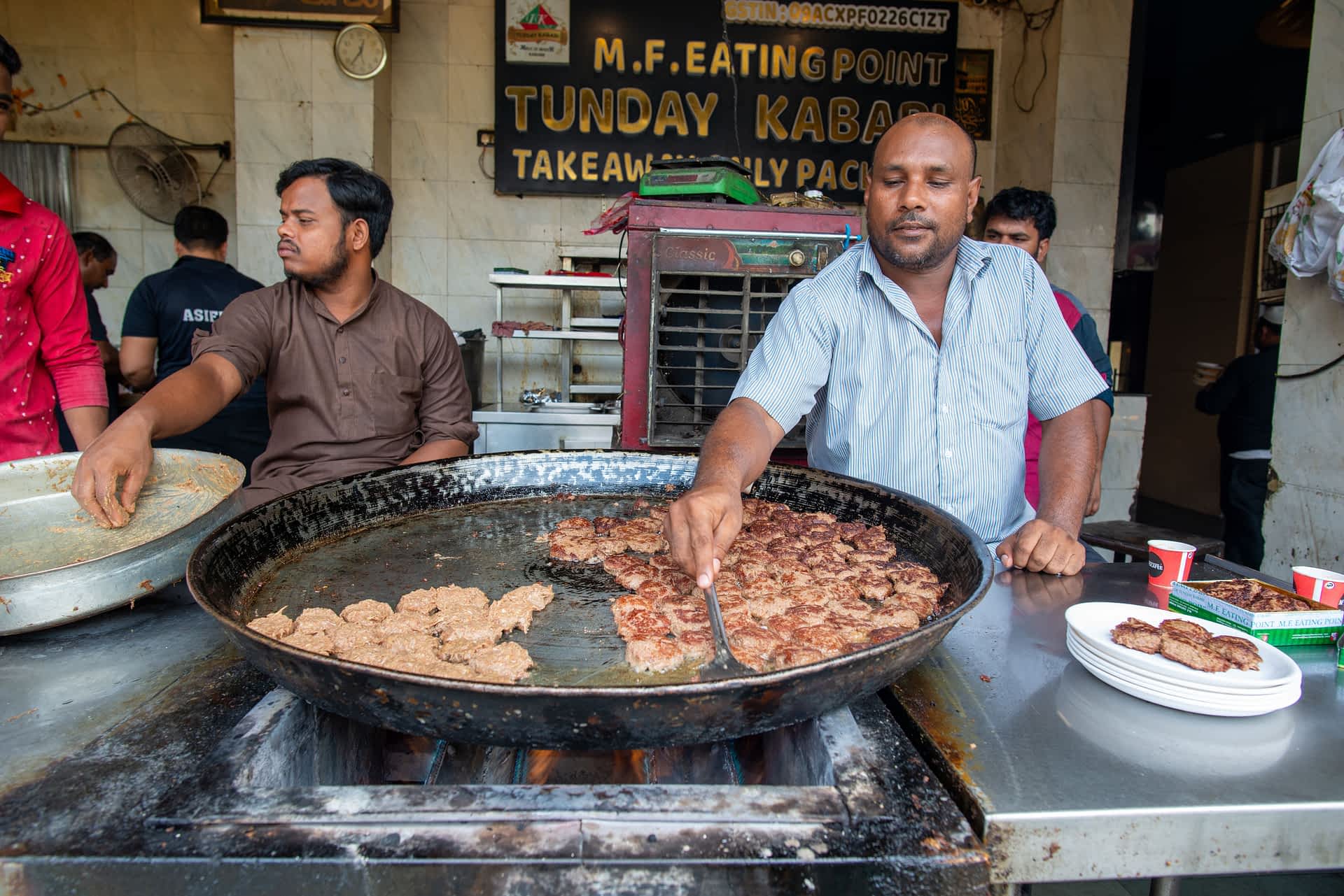 Lucknow Men fry kebabs in traditional pan, at the Tunday Ke Kabab shop in Lucknow.