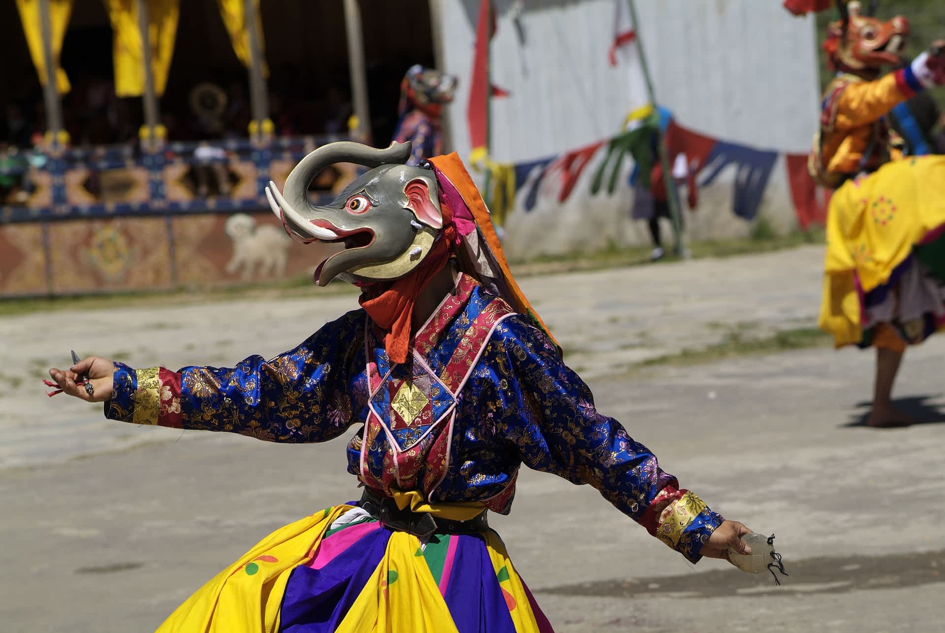 A festival in Haa, Bhutan dancers and spectators at the Tshechu featival at the White Temple (Karpho Lhakhang), Haa, Bhutan