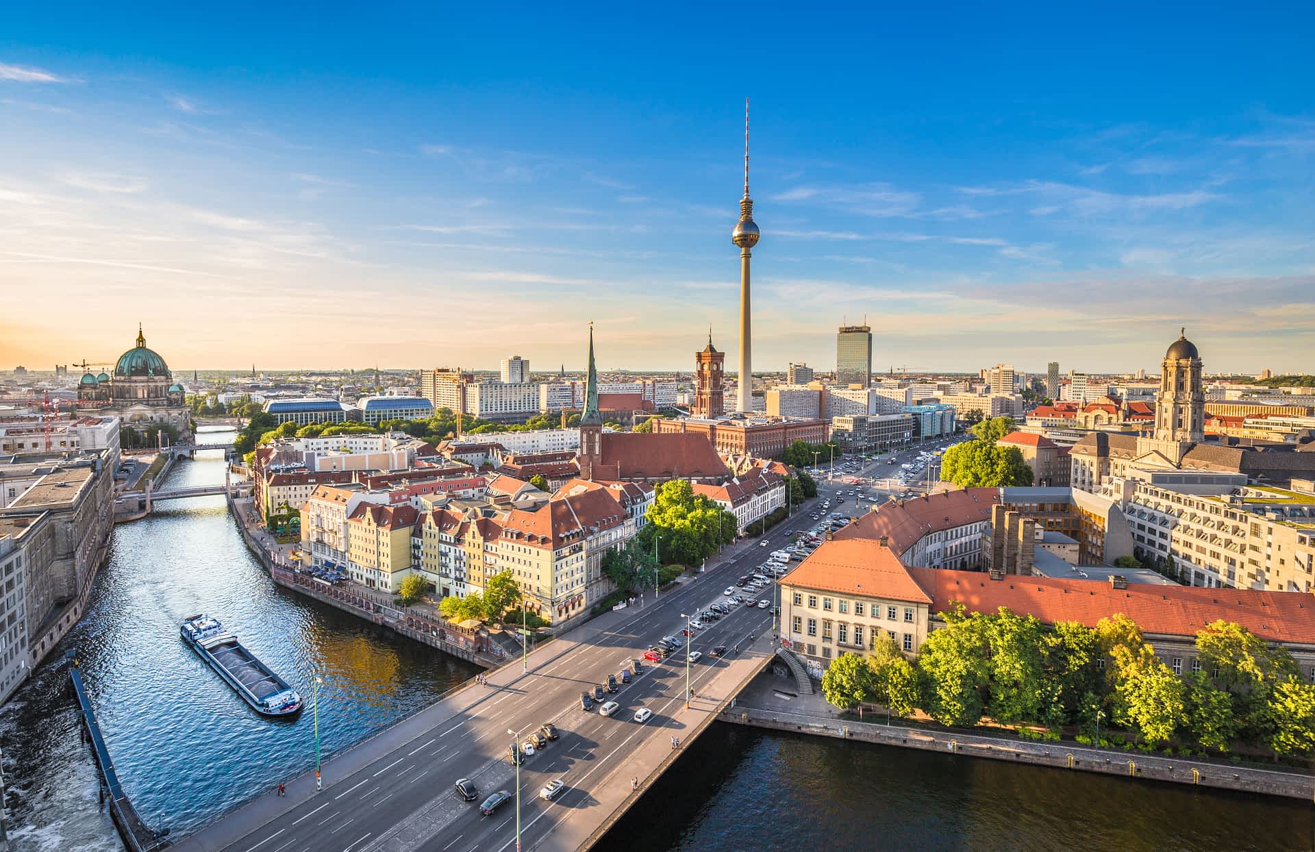 shutterstockRF337203833.jpg A cityscape and river with a tall TV tower in the center