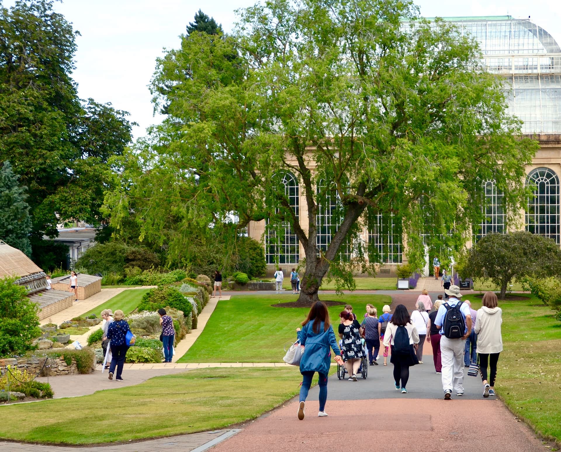Visitors walking towards the Victorian Palm House in the Royal Botanic Gardens in Edinburgh. Visitors walking towards the Victorian Palm House in the Royal Botanic Gardens in Edinburgh.