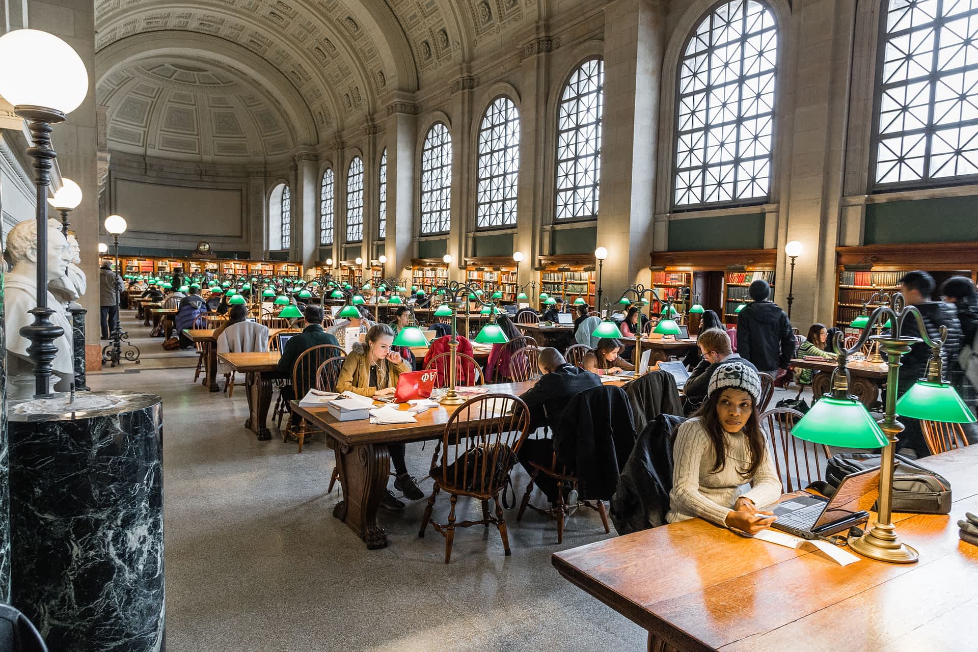 GettyRF586080604.jpg People reading books and studying at Boston Public Library, USA