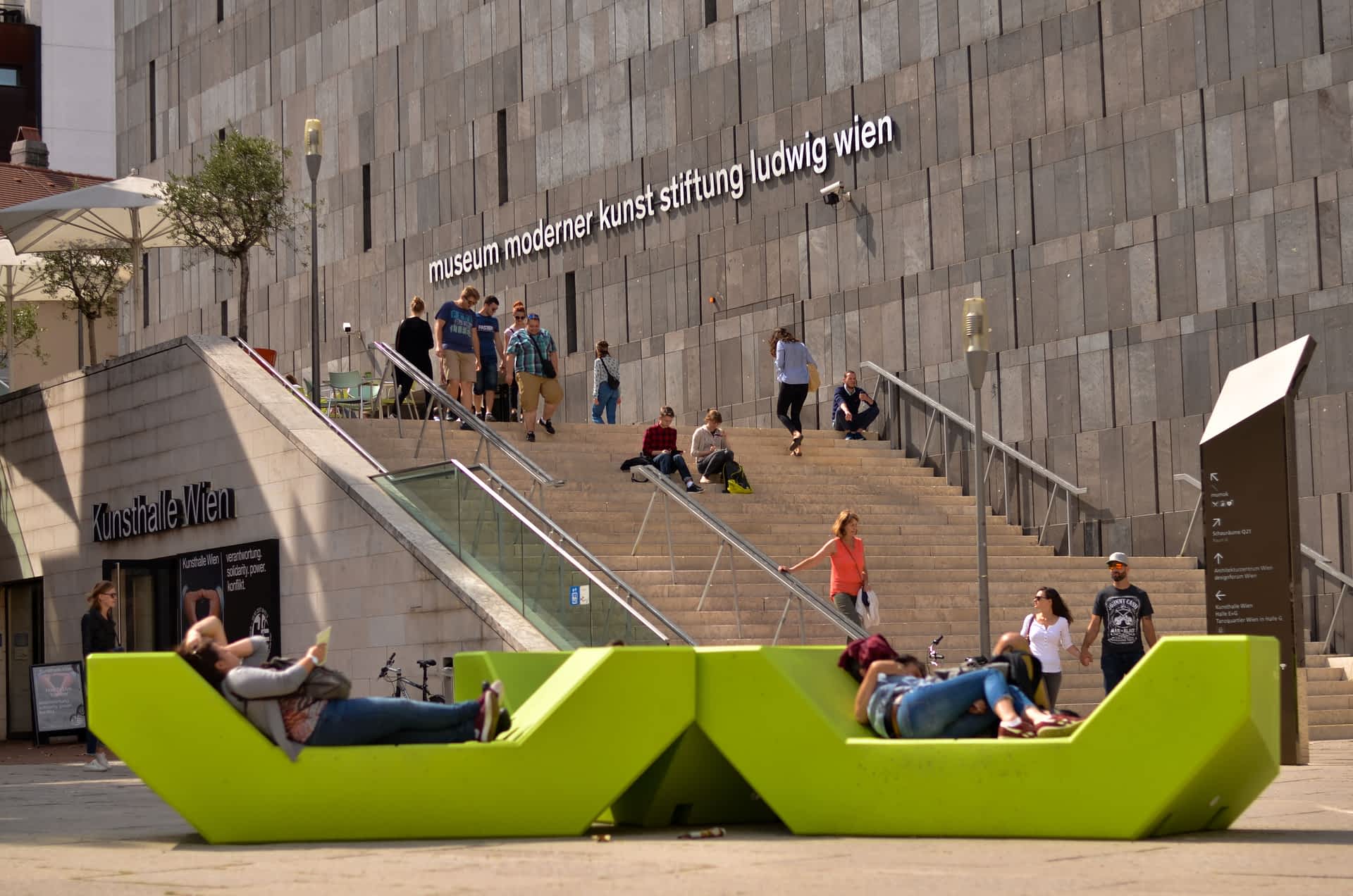 People in front of MUMOK, MuseumsQuartier, Vienna, Austria People on benches in front of MUMOK, MuseumsQuartier, Vienna, Austria