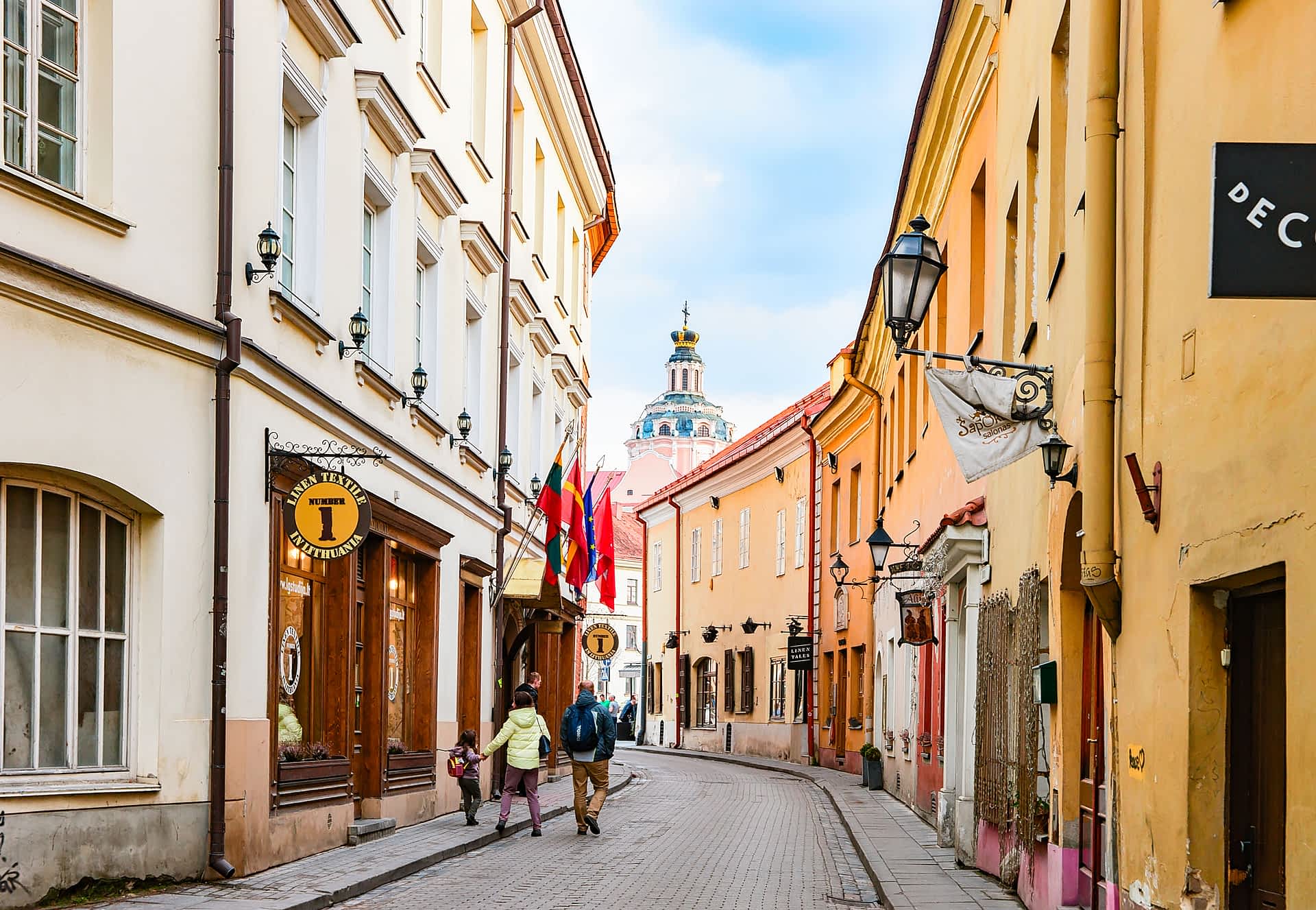 Old Town, Vilnius, Lithuania Tourists walk down a narrow street in the Old Town, Vilnius, Lithuania