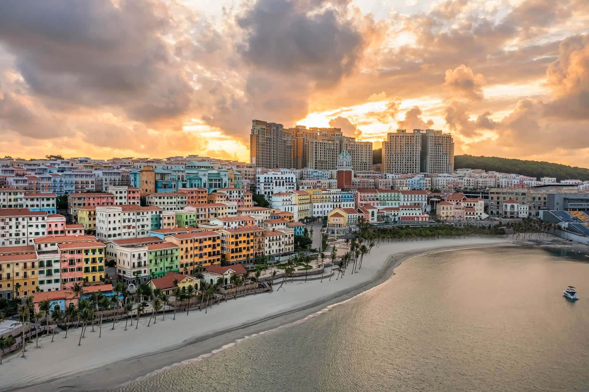 The sun sets behind the pastel buildings of Sunset Town on Phu Quoc
