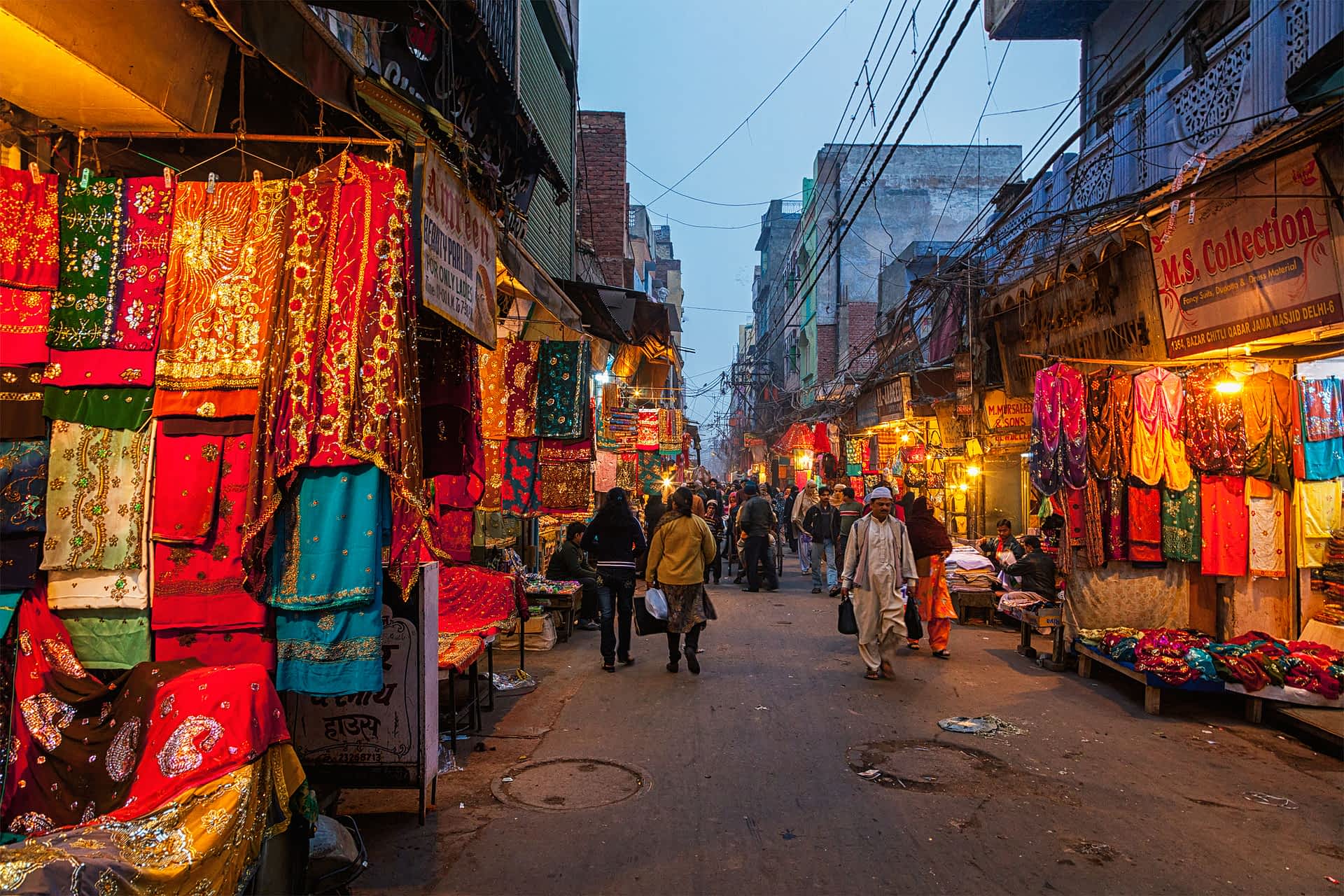 shutterstockRF404624119.jpg People on Chitli Qabar Bazar market street in New Delhi during the evening.