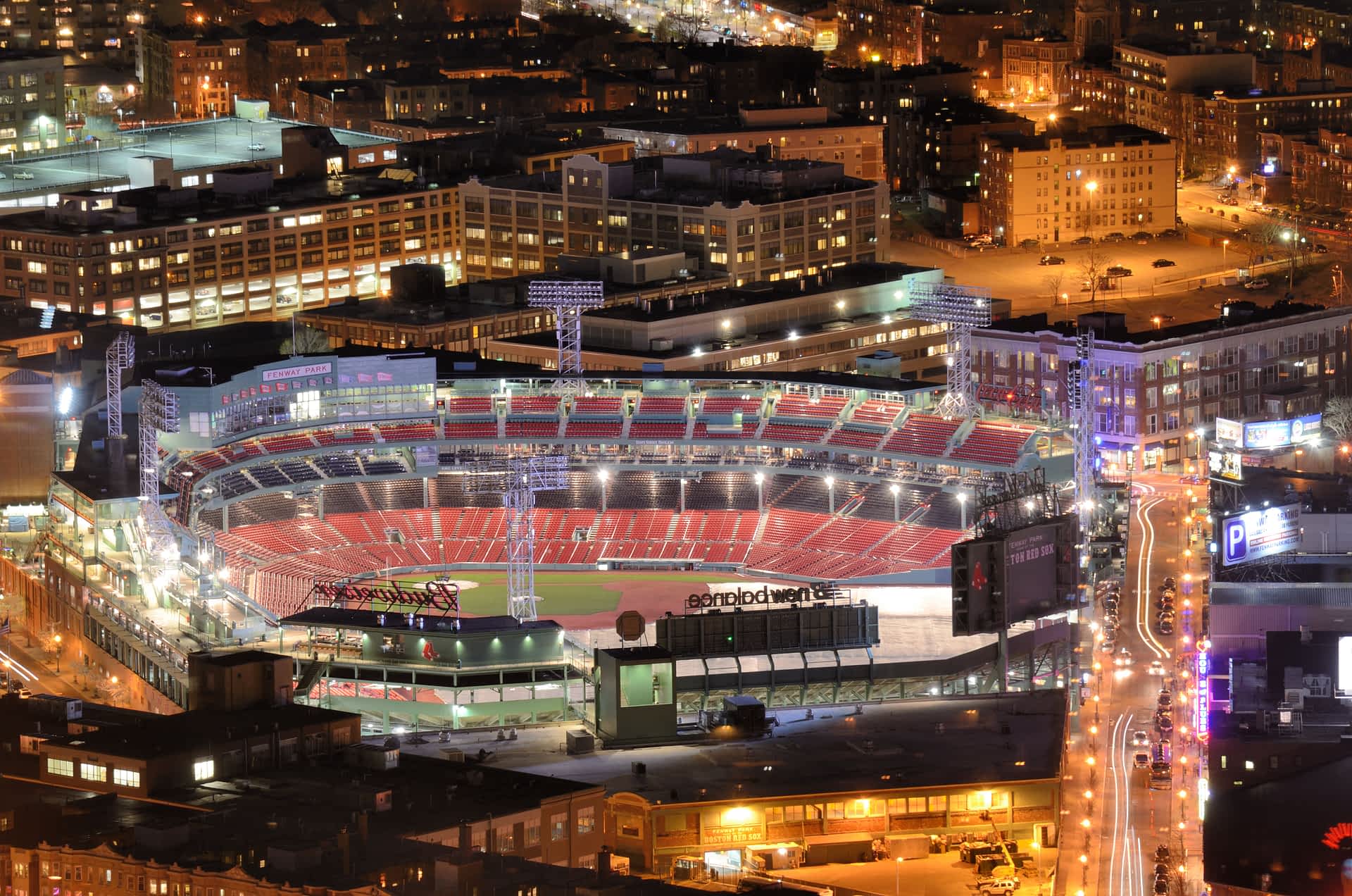 Fenway Park, Boston An aerial shot of a lit-up sports stadium in a built-up area