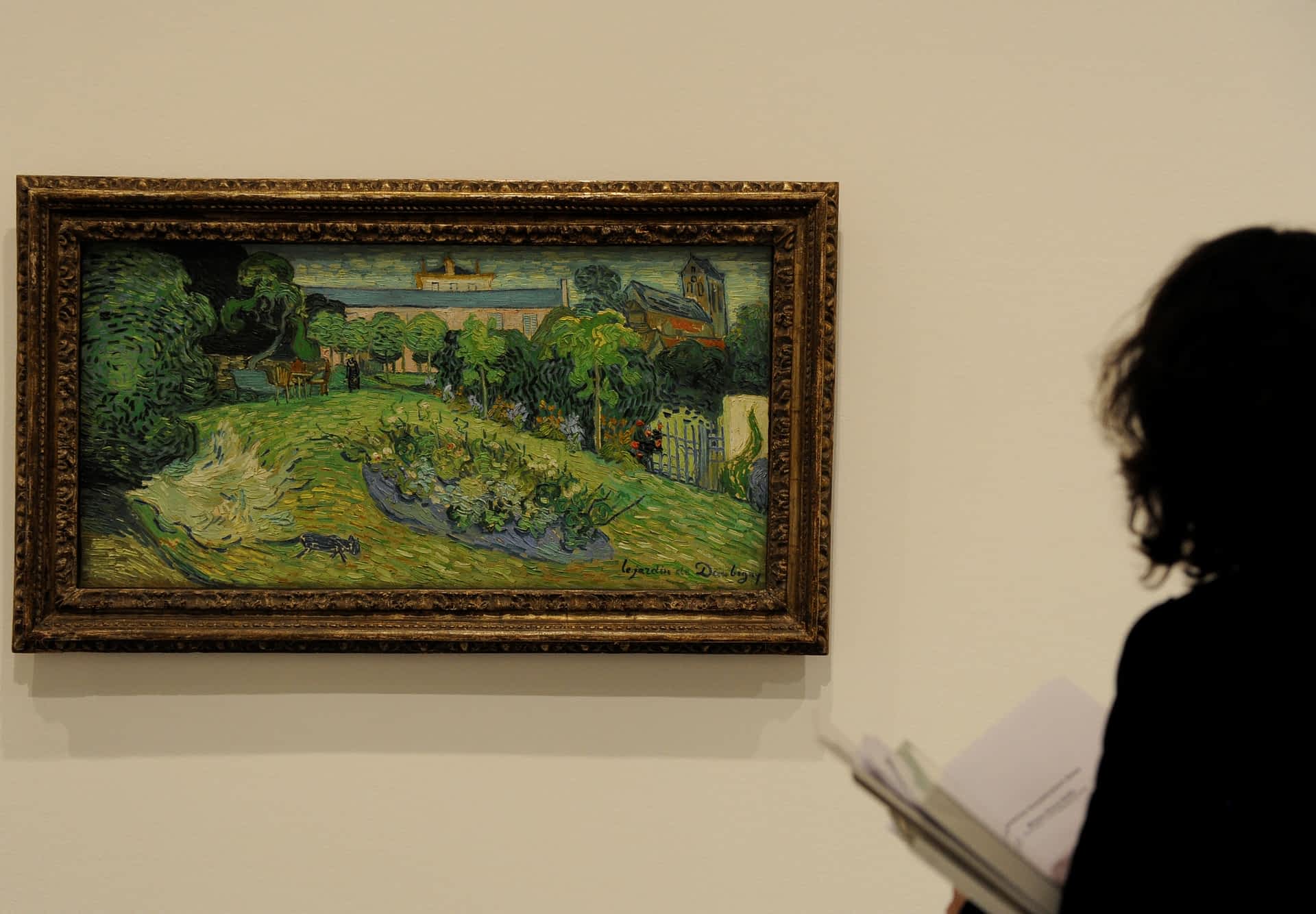 Kunstmuseum Basel Masterpieces at Prado and Reina Sofia Museum A visitor looks at the painting 'Le jardin de Daubigny' by Vincent van Gogh, which is on display at the Kunstmuseum Basel.