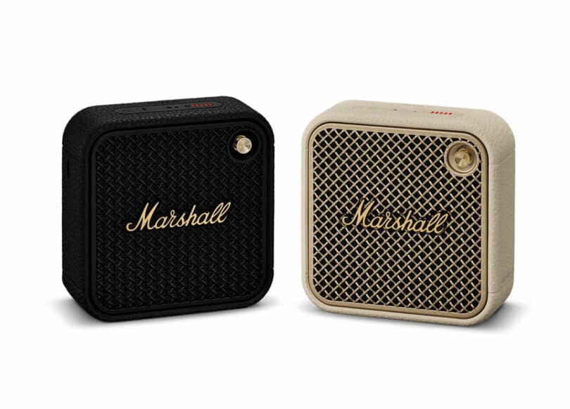 Two Marshall portable Bluetooth speakers, one in black and the other in beige, are displayed side by side. Both feature the iconic Marshall logo and a distinctive gold-colored control knob.