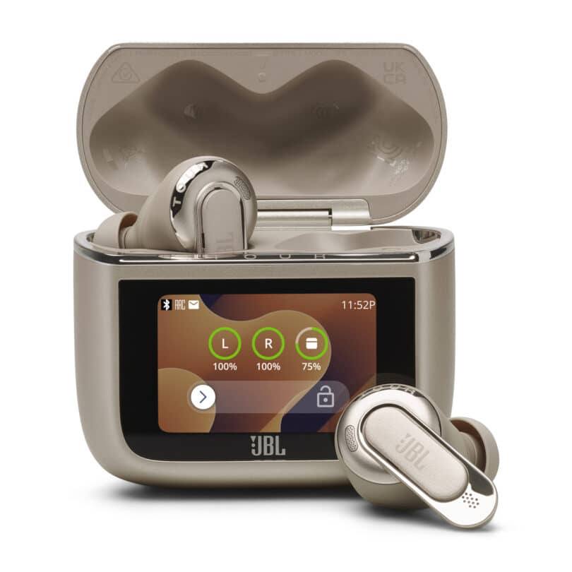 A pair of JBL wireless earbuds in a charging case with an LCD display showing battery levels for both earbuds and the case. The case lid is open and one earbud is resting inside while the other is placed in front.