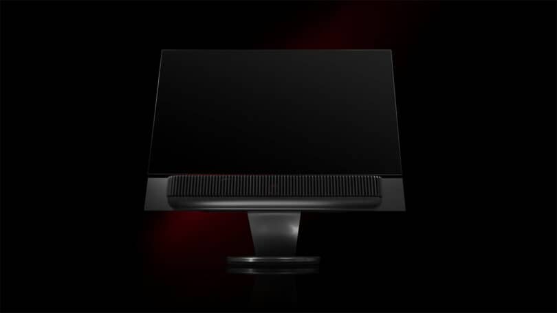 A sleek, black monitor with a thin bezel and a central stand, exuding the same elegance and precision as a Ferrari, set against a dark background.