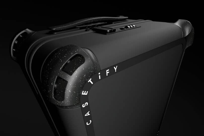 A sleek, black suitcase with rounded corners and a handle on top, featuring CASETIFY branding in white letters.