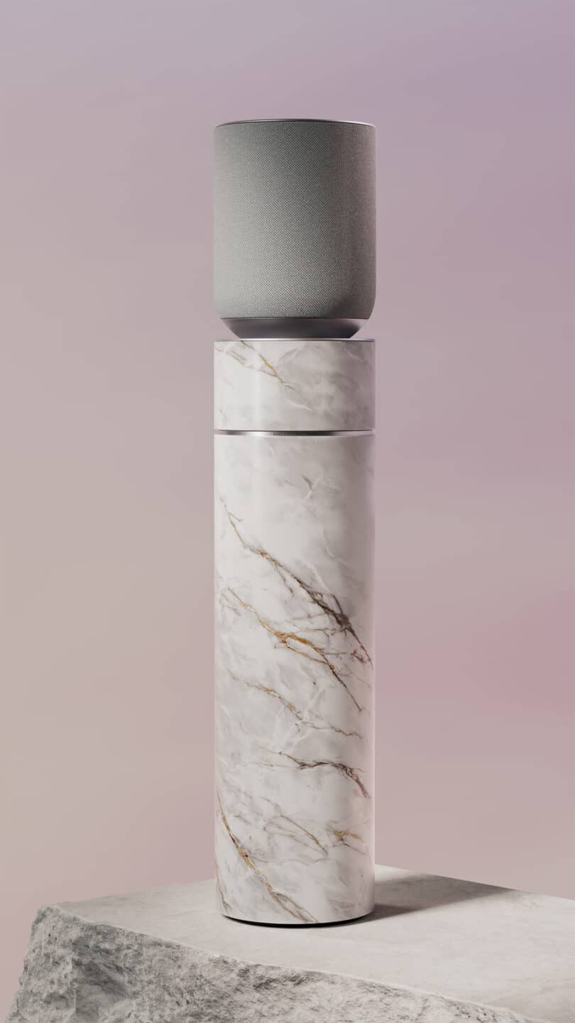 A cylindrical marble stand with a gray cylindrical speaker on top, set against a gradient pink and purple background.