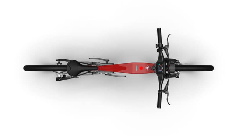 Top view of a red electric bicycle with black handlebars and seat, showcasing the battery integrated into the frame. The handlebar features controls and a screen.